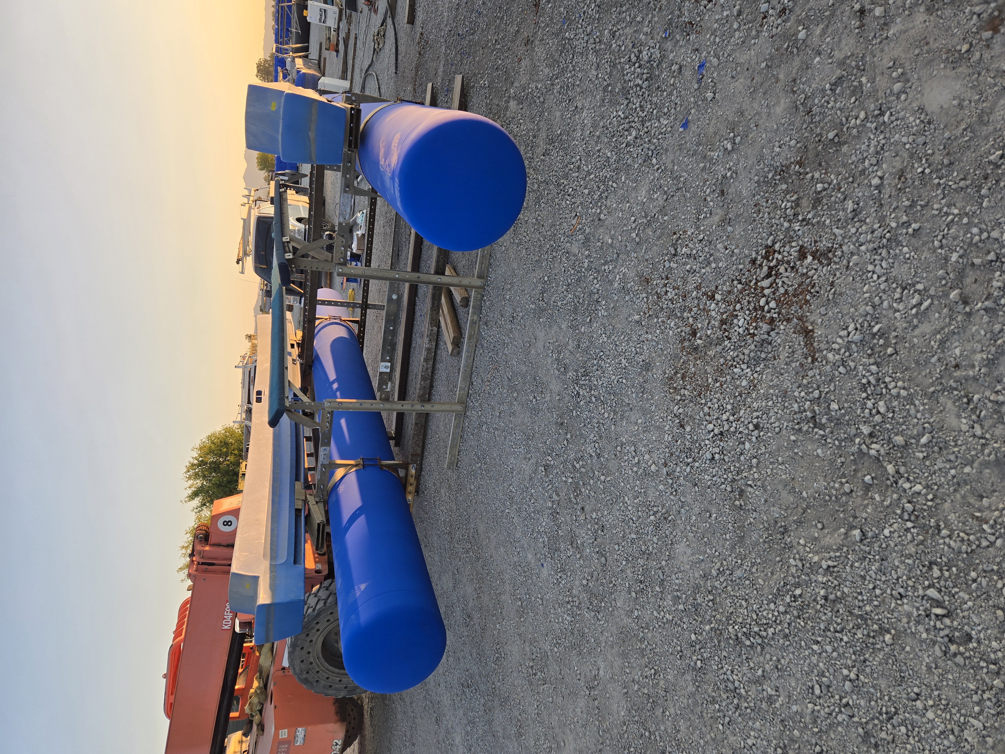 Rebuilt HydroHoist frame and blue flotation tanks prepared for installation