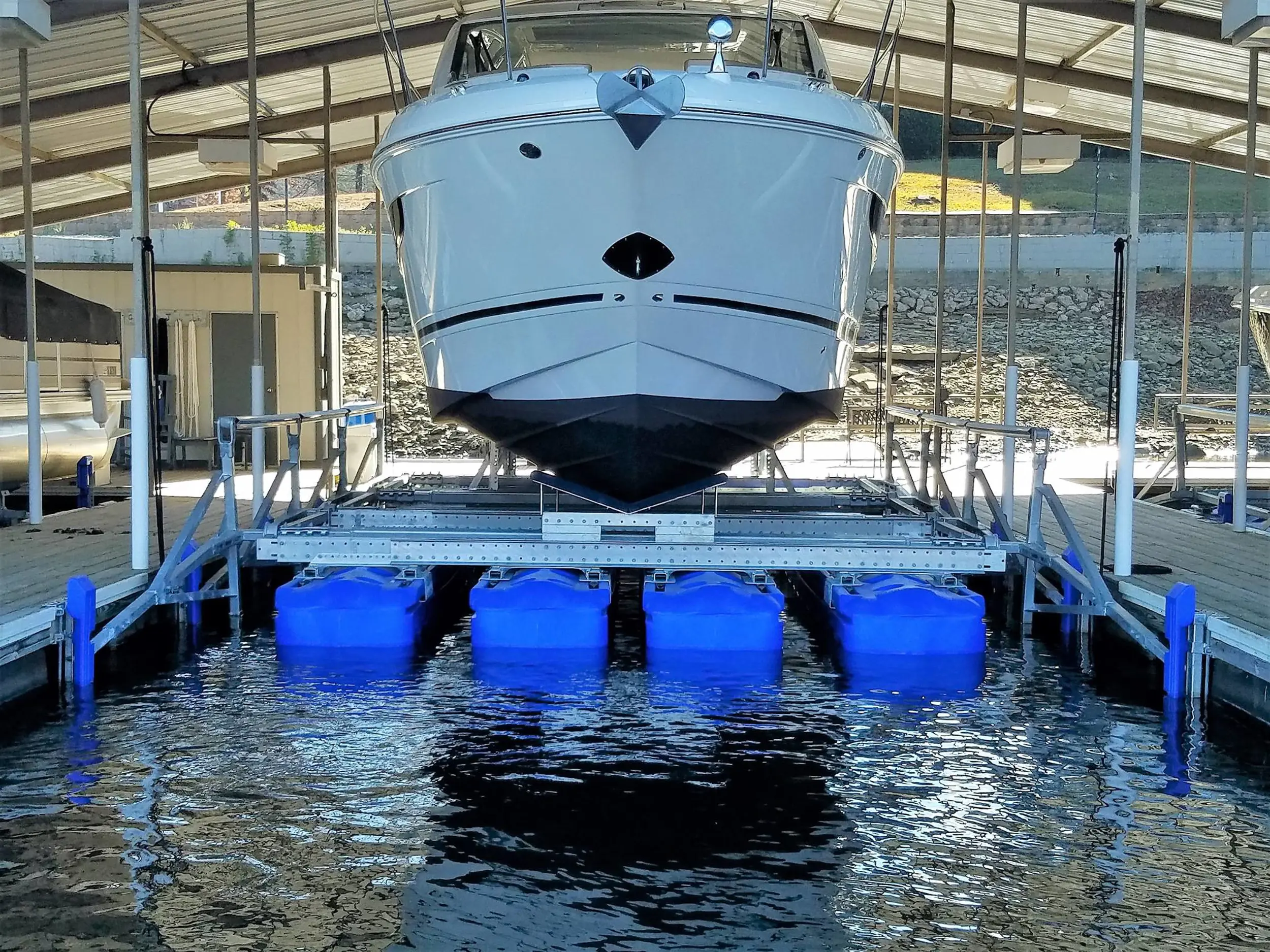 HydroHoist boat lift installation in a covered marina slip