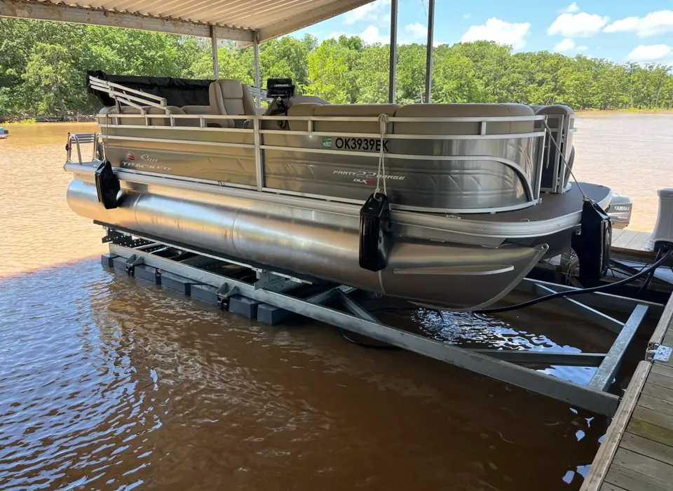 HydroHoist boat lift system with boat raised above the water